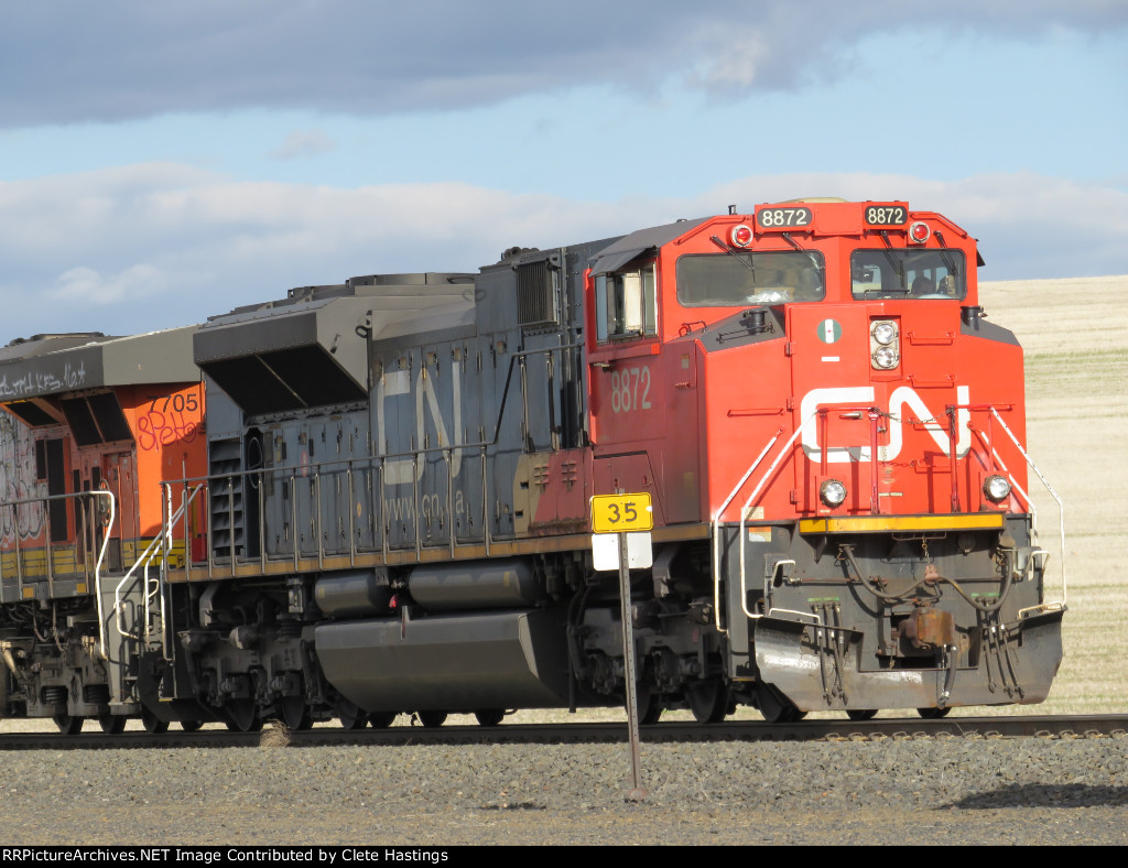 CN 8872 leads an EB oil train with a GEVO in tow.